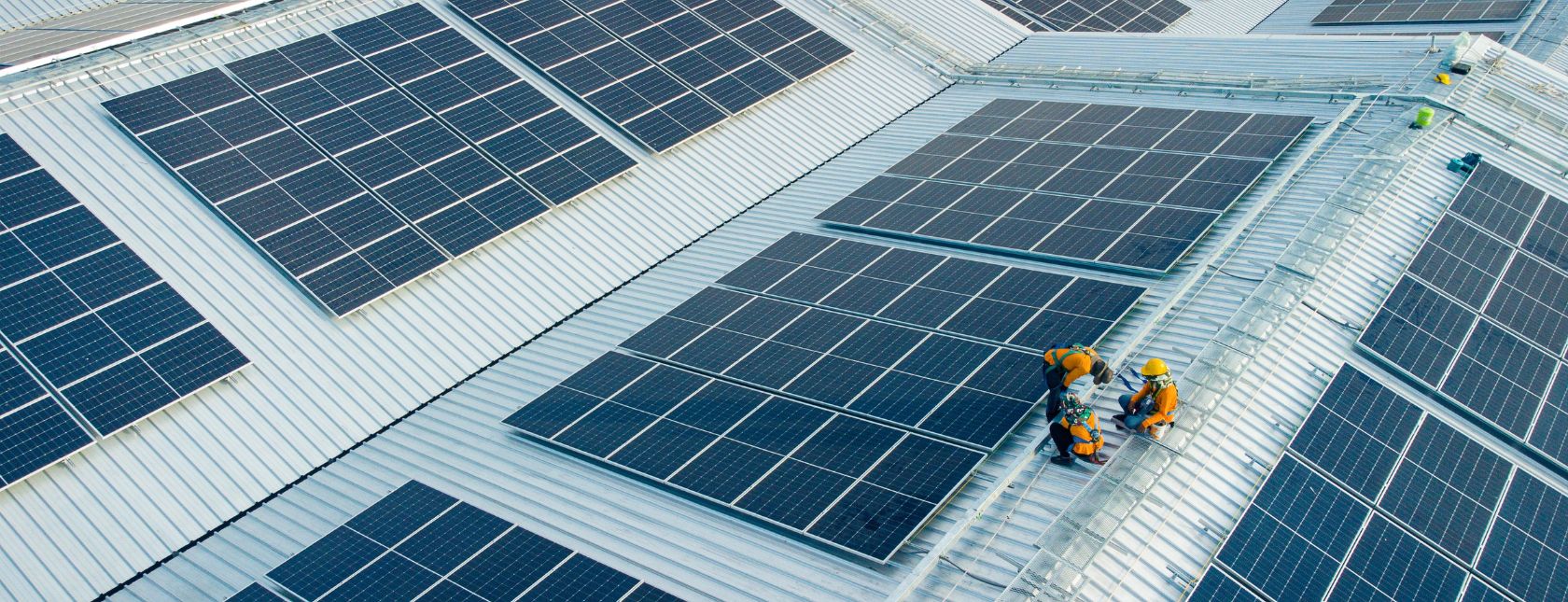 workers installing solar panels