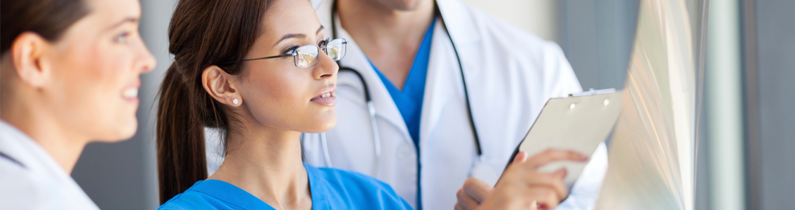 Medical staff examining charts as Banner image for Comprehensive Accreditation training course