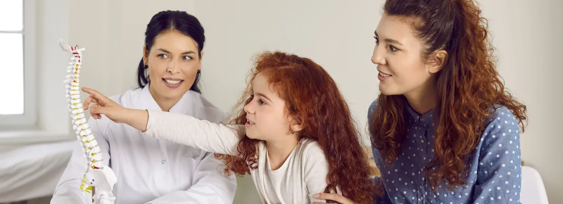 Mother and daughter consulting a doctor