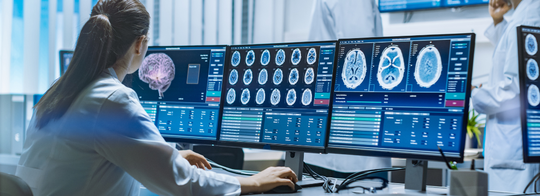 A doctor examines brain scans