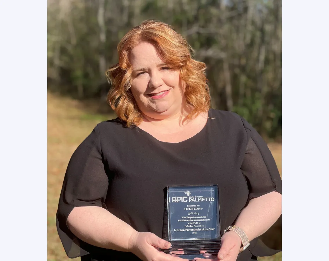 Leslie Lloyd displays 2022 Infection Preventionist of the Year Award